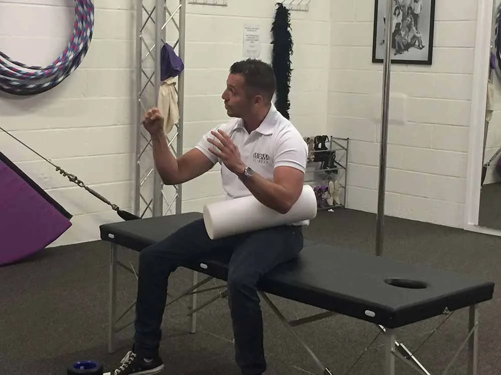 MGM Clinics practitioner giving a talk to a group
