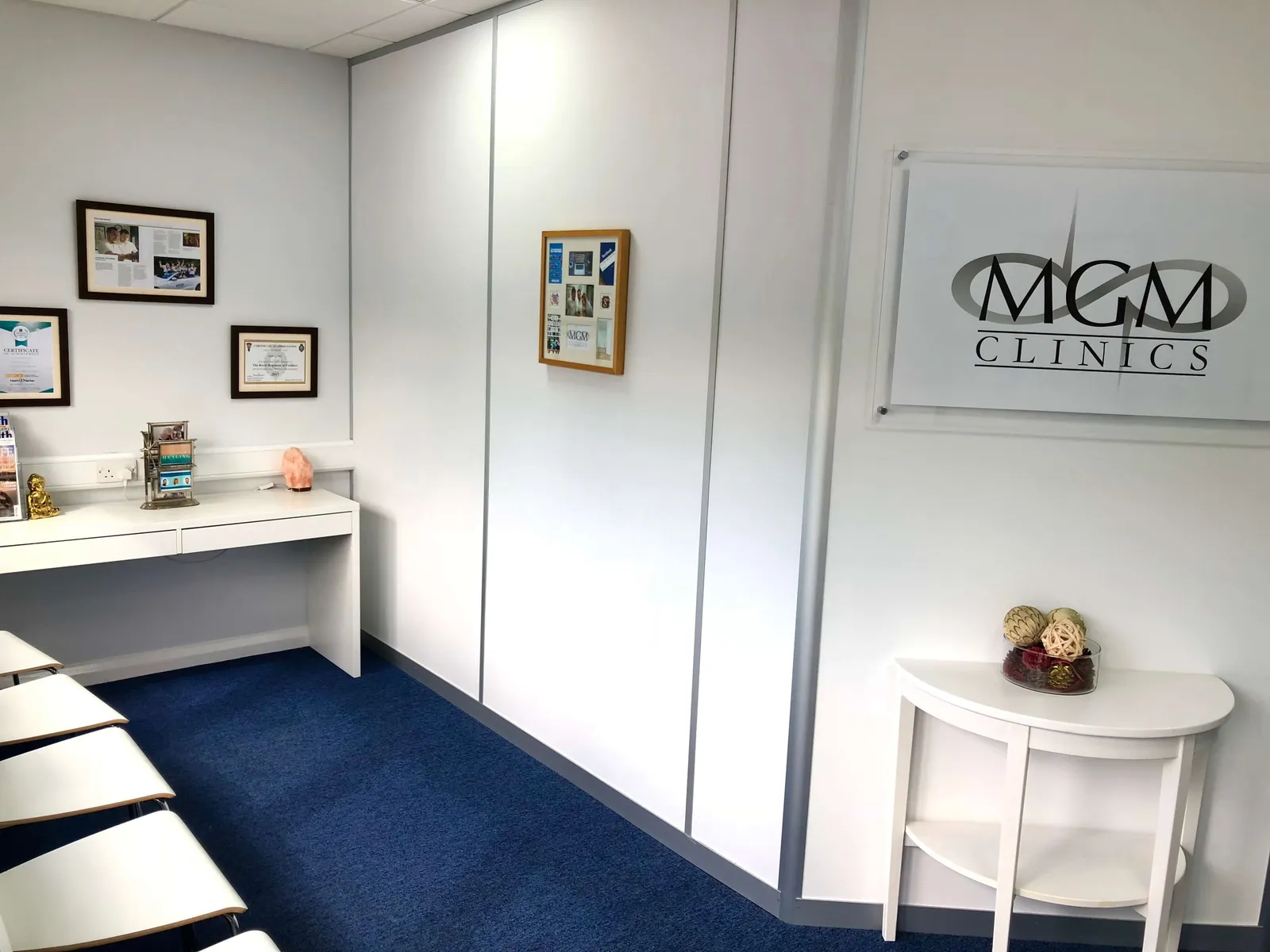 Treatment room with the MGM Clinics logo on the wall