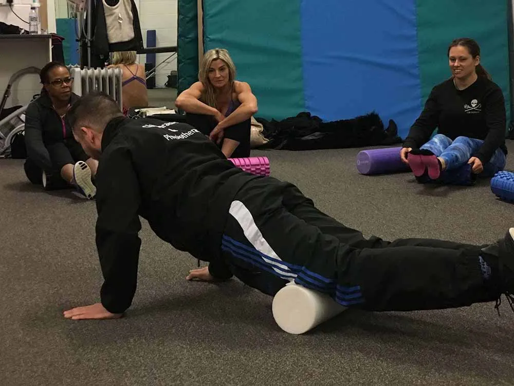MGM Clinics team leading a foam roller session